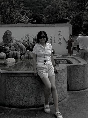 Yufei in front of a fountain
